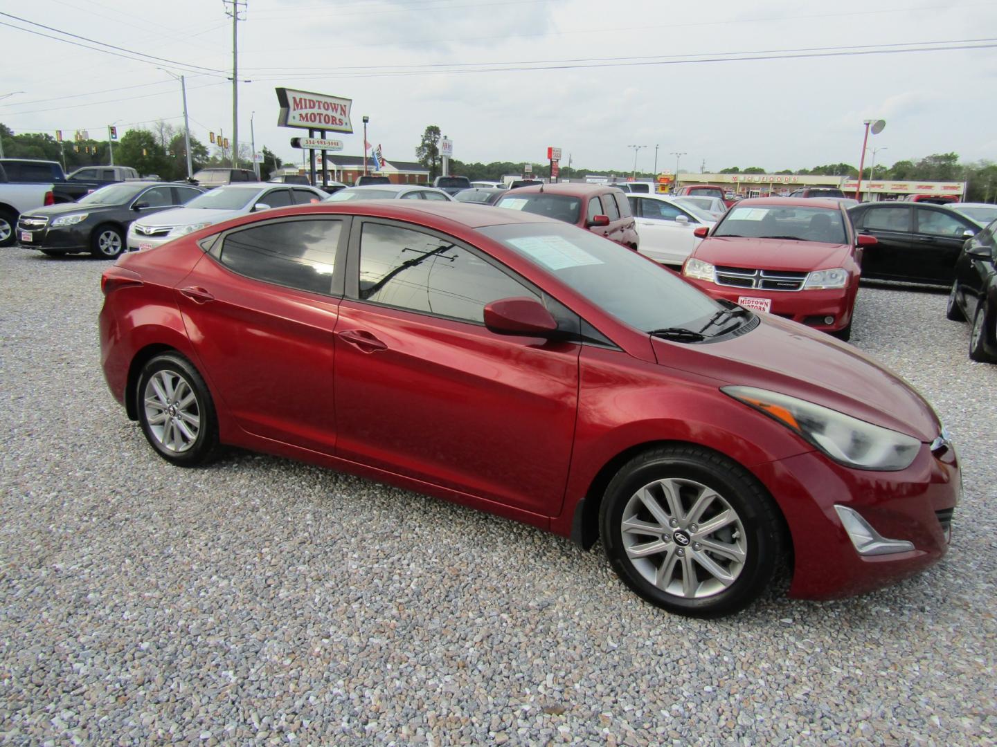 2016 Red /Gray Hyundai Elantra Limited (5NPDH4AE2GH) with an 1.8L L4 DOHC 16V engine, Automatic transmission, located at 15016 S Hwy 231, Midland City, AL, 36350, (334) 983-3001, 31.306210, -85.495277 - Photo#0